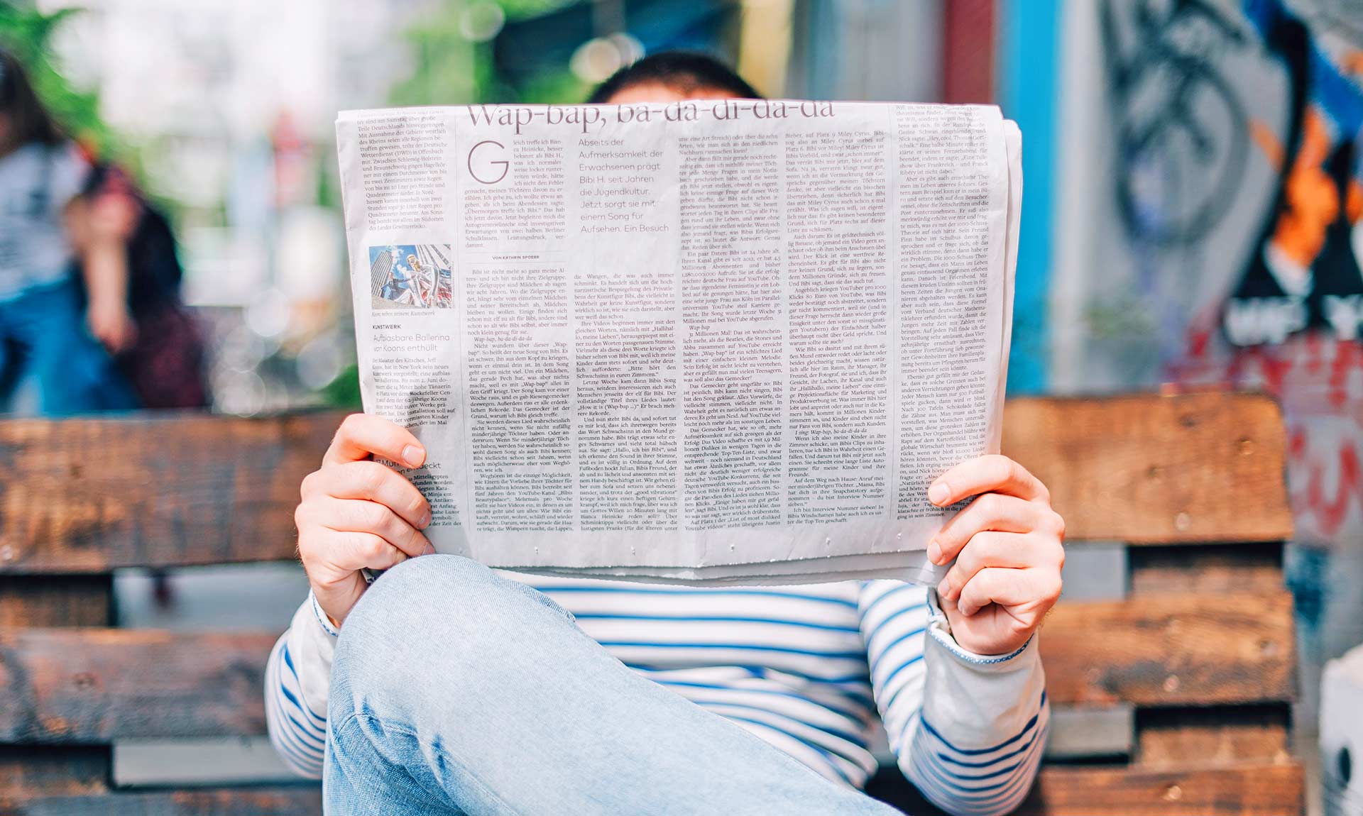 Person Reading Newspaper